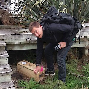 Fabian and a mustelid trap that he's set and baited.
